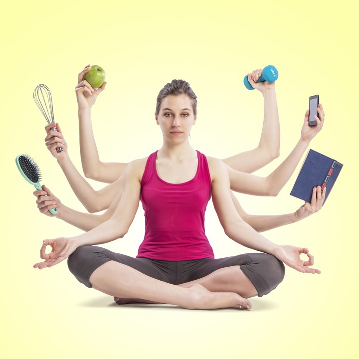 multi tasking woman portrait in yoga position with many arms